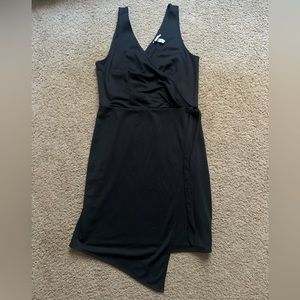 NWOT. A new day. Black asymmetrical wrap, tie on the side dress.